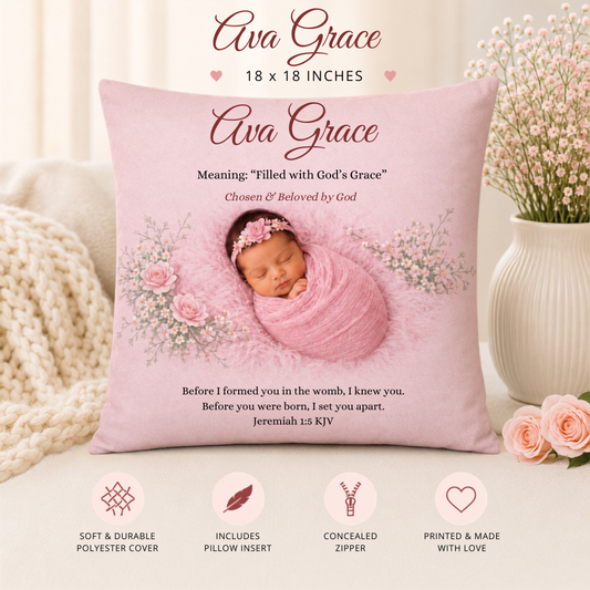 Pink pillow with a baby photo and text, placed on a couch with decorative elements.