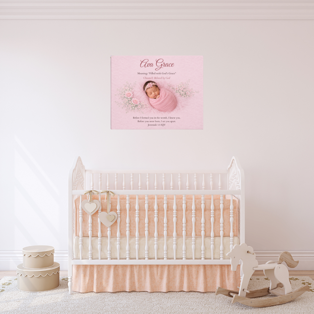 Baby crib with pink bedding and a rocking horse in a nursery setting, featuring a framed photo of a baby on the wall.